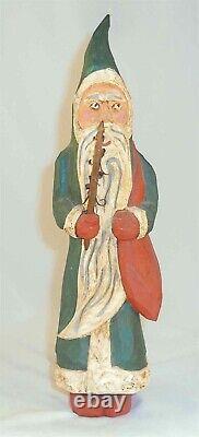 1988 Hand Carved Painted Wood Folk Art Santa Clause or Belsnickel By J Bastian
