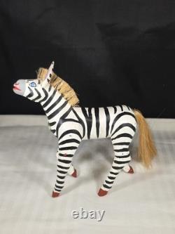 A hand carved and painted Mexican folk art mystical zebra alebrije