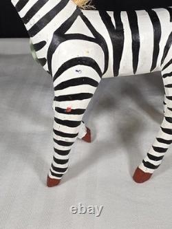 A hand carved and painted Mexican folk art mystical zebra alebrije