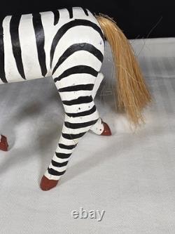 A hand carved and painted Mexican folk art mystical zebra alebrije