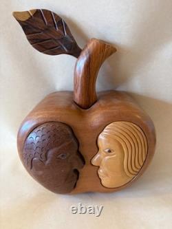 Amazing folk art wooden sculpture, two faces on drawers that open from an apple