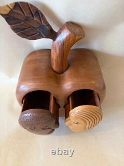 Amazing folk art wooden sculpture, two faces on drawers that open from an apple