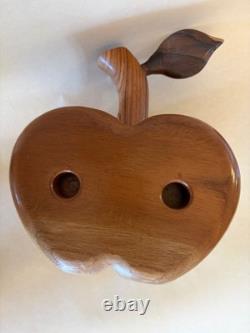 Amazing folk art wooden sculpture, two faces on drawers that open from an apple