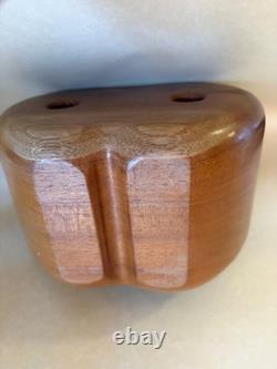 Amazing folk art wooden sculpture, two faces on drawers that open from an apple