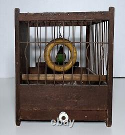 Antique FOLK ART CARVED & PAINTED WOOD BIRD ON SWING IN CAGE