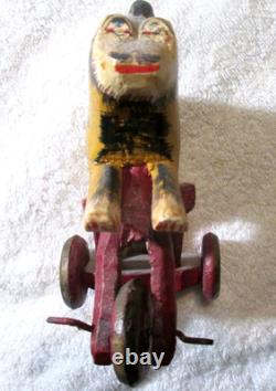 Antique Primitive Folk Art Hand Carved Wood Toy Monkey Riding Tricycle