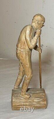 Antique hand carved wood Folk Art lumberjack man cutting wood sculpture statue