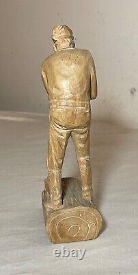 Antique hand carved wood Folk Art lumberjack man cutting wood sculpture statue