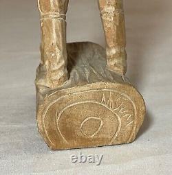 Antique hand carved wood Folk Art lumberjack man cutting wood sculpture statue