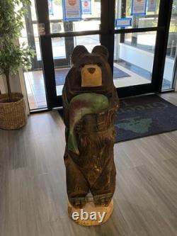 Chainsaw Carved Bear Holding A Fish, 48 Inches Tall, 13 Inches. Hand Painted