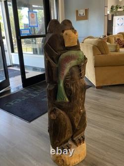 Chainsaw Carved Bear Holding A Fish, 48 Inches Tall, 13 Inches. Hand Painted