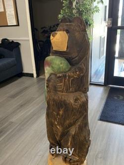 Chainsaw Carved Bear Holding A Fish, 48 Inches Tall, 13 Inches. Hand Painted