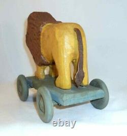 Contemporary Hand Carved Painted Wood Primitive Folk Art Lion Pull Toy on Wheels