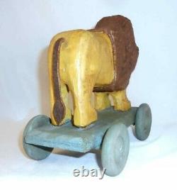 Contemporary Hand Carved Painted Wood Primitive Folk Art Lion Pull Toy on Wheels