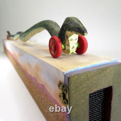 DONA DALTON folk art carved wood WAVY SNAKE @ HOME wooden sculpture toy wheels