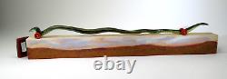 DONA DALTON folk art carved wood WAVY SNAKE @ HOME wooden sculpture toy wheels