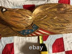 Folk Art carved eagle with flag and carved stars