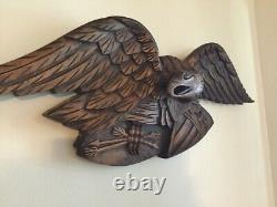 Folk Art carved eagle with shield and arrows