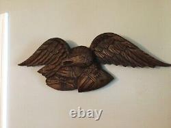 Folk Art carved eagle with shield and arrows