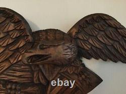 Folk Art carved eagle with shield and arrows