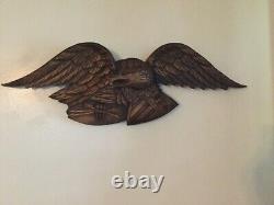 Folk Art carved eagle with shield and arrows