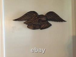 Folk Art carved eagle with shield and arrows