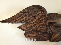 Folk Art carved eagle with shield and arrows