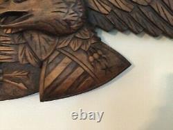 Folk Art carved eagle with shield and arrows