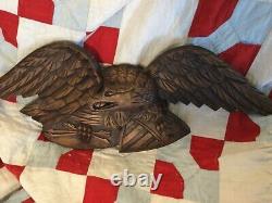 Folk Art carved eagle with shield and arrows