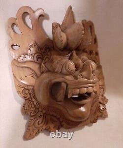 Hand carved wooden balinese barong demon Indonesian folk art