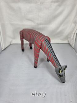 Intricately Patterned Carved Wooden Dog Is A Type of Mexican Folk Art Sculpture