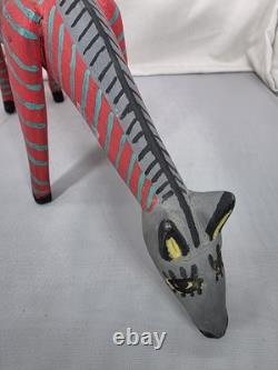 Intricately Patterned Carved Wooden Dog Is A Type of Mexican Folk Art Sculpture