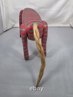 Intricately Patterned Carved Wooden Dog Is A Type of Mexican Folk Art Sculpture