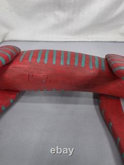 Intricately Patterned Carved Wooden Dog Is A Type of Mexican Folk Art Sculpture