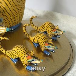 Oaxacan wood-carved alebrije depicting a possum with three babies