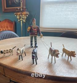 Original Primitive Folk Art Santa Walking / Herding 5 Dogs Ken Lessnau wood