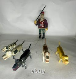 Original Primitive Folk Art Santa Walking / Herding 5 Dogs Ken Lessnau wood