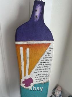 Painted wooden sculpture, known as a StoryPeople piece by the artist