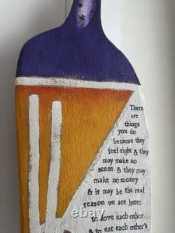 Painted wooden sculpture, known as a StoryPeople piece by the artist