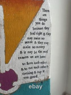 Painted wooden sculpture, known as a StoryPeople piece by the artist