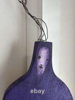 Painted wooden sculpture, known as a StoryPeople piece by the artist