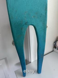 Painted wooden sculpture, known as a StoryPeople piece by the artist