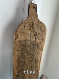 Painted wooden sculpture, known as a StoryPeople piece by the artist