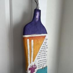 Painted wooden sculpture, known as a StoryPeople piece by the artist