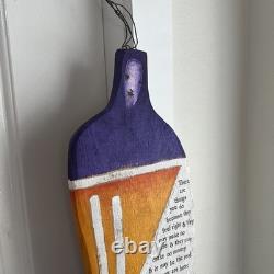 Painted wooden sculpture, known as a StoryPeople piece by the artist