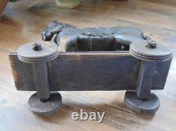 Unique old vintage HAND CARVED WOOD HORSE sculpture on wheels folk art