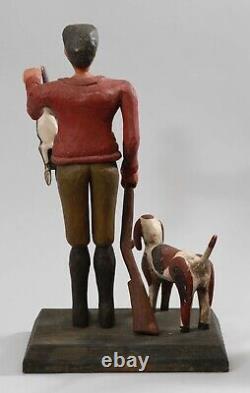 Vintage Folk Art wood carving sculpture of hunter, dog, rabbit