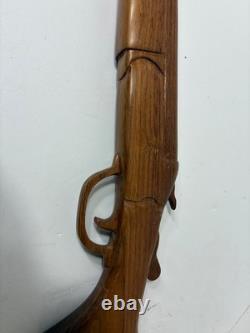 Wood carved single barrel shotgun approximately 40 inches long