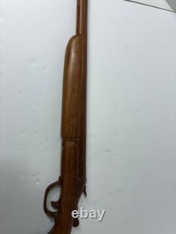 Wood carved single barrel shotgun approximately 40 inches long