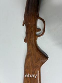 Wood carved single barrel shotgun approximately 40 inches long